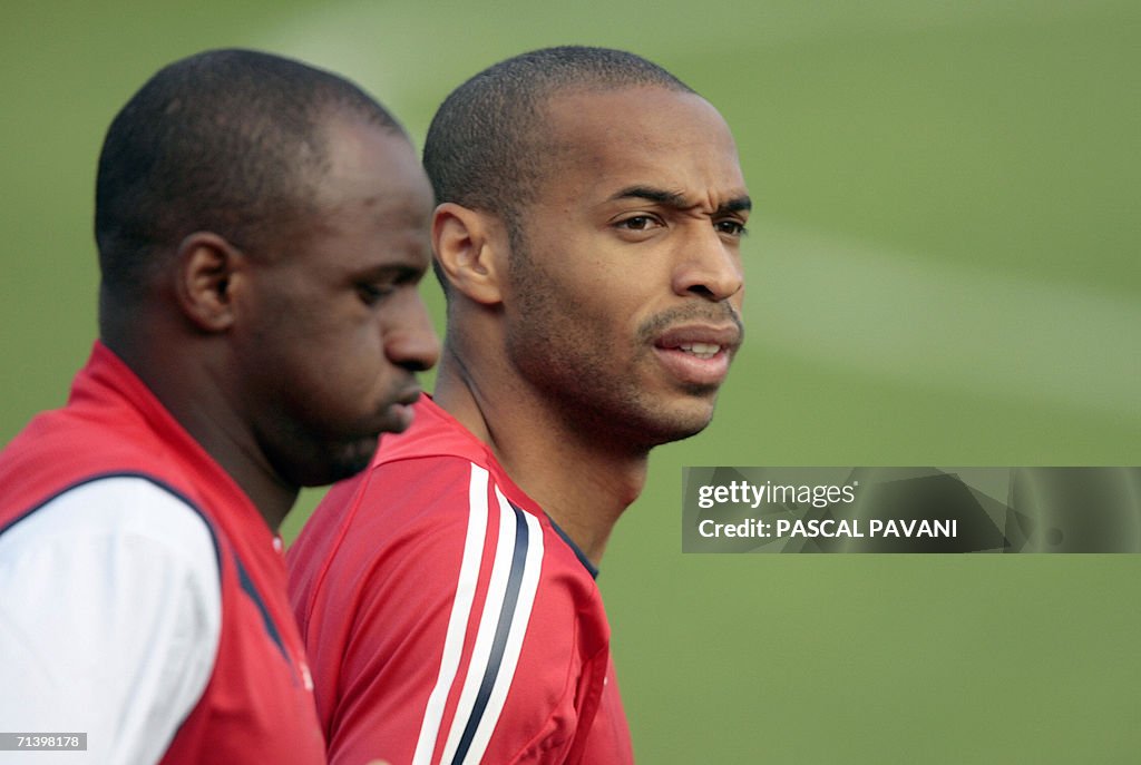 French midfielder Patrick Vieira (L) and