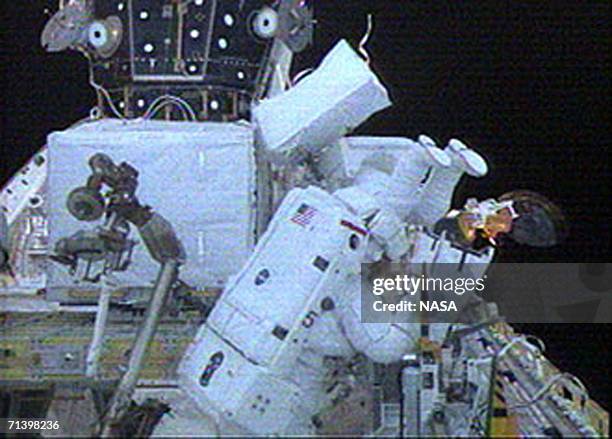 Mission Specialists Piers Sellers and Mike Fossum conduct the first spacewalk of the STS-121 mission July 8, 2006 in space. The two astronauts made...