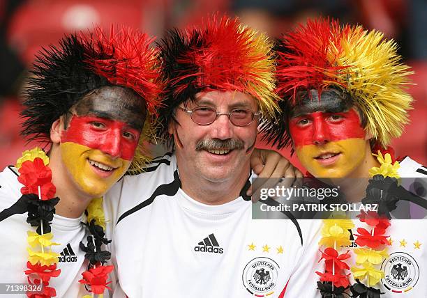 Germany supporters pose as they wait for the start of the third-place playoff 2006 World Cup football match between Germany and Portugal at...