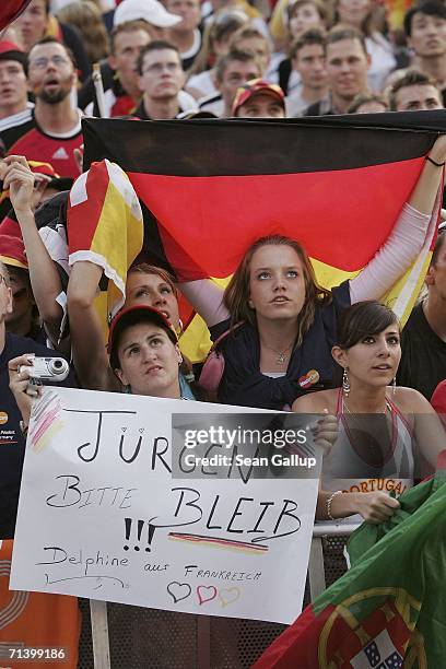 Germany soccer fans a hold a sign that reads: "Jurgen, stay!" in reference to German national team coach Jurgen Klinsmann, whose future is uncertain,...