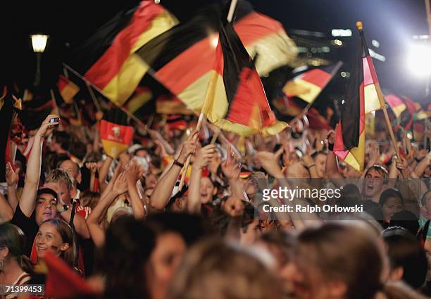 German football supporters celebrate a goal of their team at a public viewing area on July 8, 2006 in Stuttgart, Germany. Today Germany plays against...