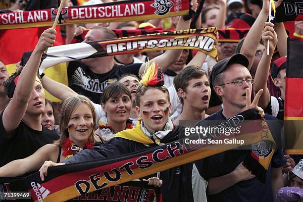 Germany soccer fans celebrate while watching the FIFA World Cup 2006 match for third place between Portugal and Germany at the Fan Fest outdoor...