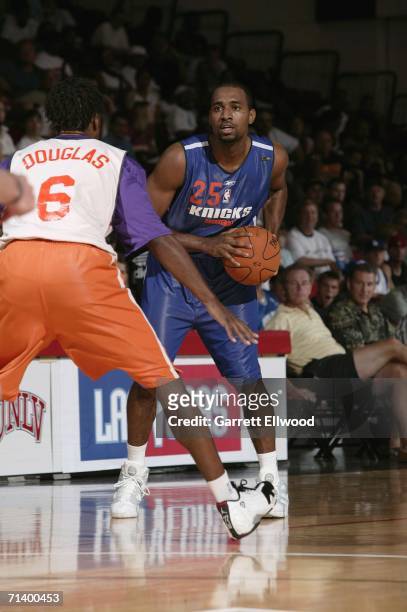 Mardy Collins of the New York Knicks looks to drive against Ruben Douglas of the Phoenix Suns during the 2006 Toshiba Vegas Summer League on July 8,...