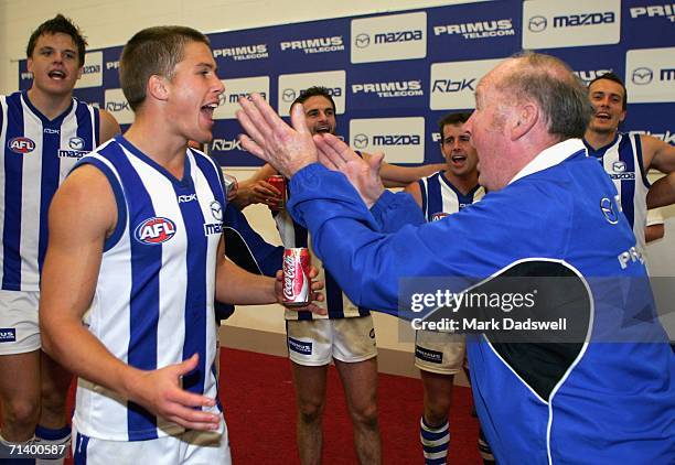 Andrew Swallow sings the club song after winning the round 14 AFL match between the Western Bulldogs and the Kangaroos at the Melbourne Cricket...