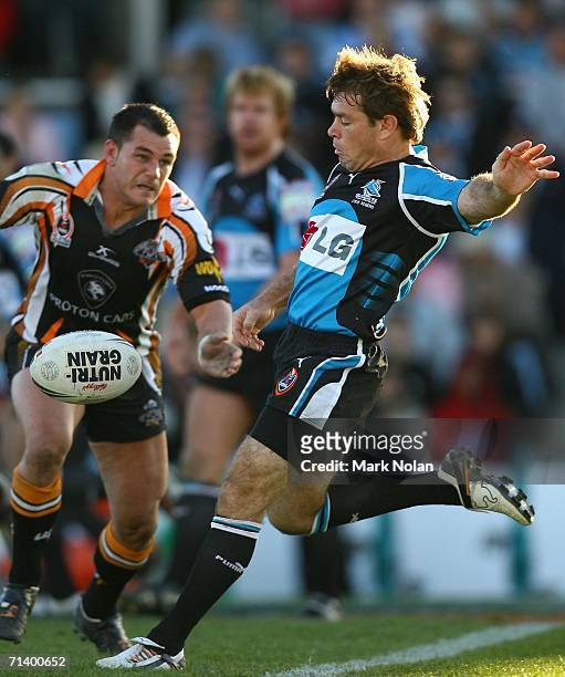 Brett Kimmorley of the Sharks kicks during the round 18 NRL match between the Cronulla Sharks and Wests Tigers played at Toyota Park on July 9, 2006...