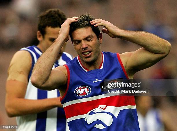 Rohan Smith of the Bulldogs shows his frustration at missing a shot on goal during the round fourteen AFL match between the Western Bulldogs and the...