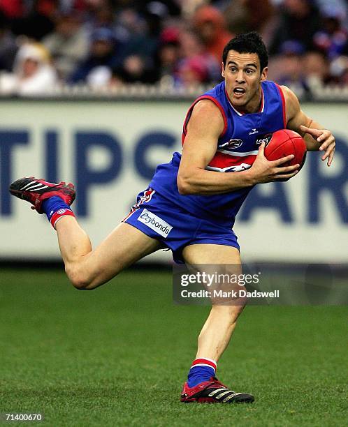 Lindsay Gilbee of the Bulldogs gathers the ball during the round 14 AFL match between the Western Bulldogs and the Kangaroos at the Melbourne Cricket...