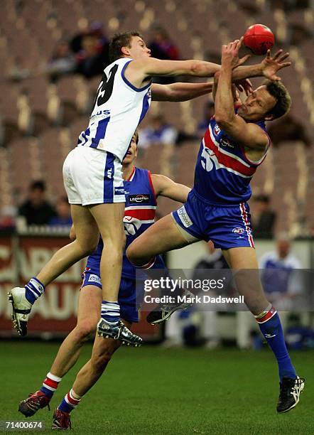 Leigh Harding of the Kangaroos spoils Chris Grant of the Bulldogs during the round fourteen AFL match between the Western Bulldogs and the Kangaroos...