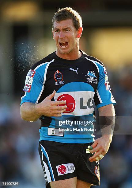 Nolan Stringer Adam Dykes of the Sharks barks orders to his team during the round 18 ...
