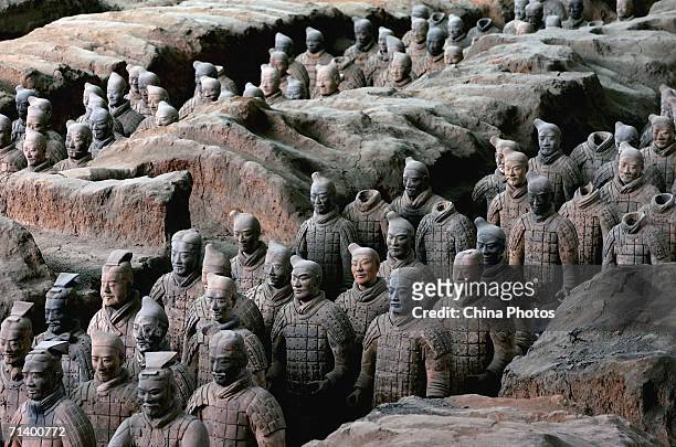 Ancient terracotta warriors stand in a pit at the Emperor Qin's Terracotta Warriors and Horses Museum on July 7, 2006 in Lintong County of Shaanxi...