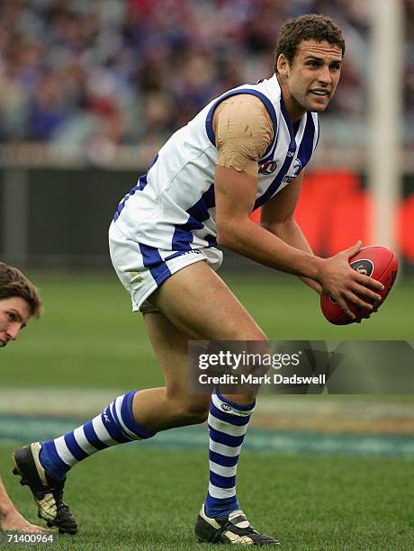 Ben Schwarze of the Kangaroos looks for a teammate during the round fourteen AFL match between the Western Bulldogs and the Kangaroos at the...