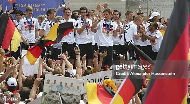 The German National Team arrive at the Berlin Fan Mile at the Brandenburg Gate on July 9, 2006 in Berlin, Germany. Hundreds of thousends of fans...