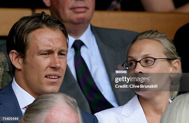 England Rugby player Jonny Wilkinson and guest Shelley Jenkins watch the centre court action as Roger Federer of Switzerland and Rafael Nadal of...