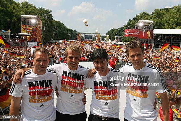 Germany's goalkeeper's trainer Andreas Koepke, head coach Juergen Klinsmann, assistant coach Joachim Loew and team manager Oliver Bierhoff pose as...