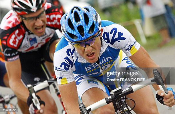 Saint-Meen-le-Grand, FRANCE: France's Samuel Dumoulin rides in front of Germany's Jens Voigt as they break away from the pack during the 181 km...