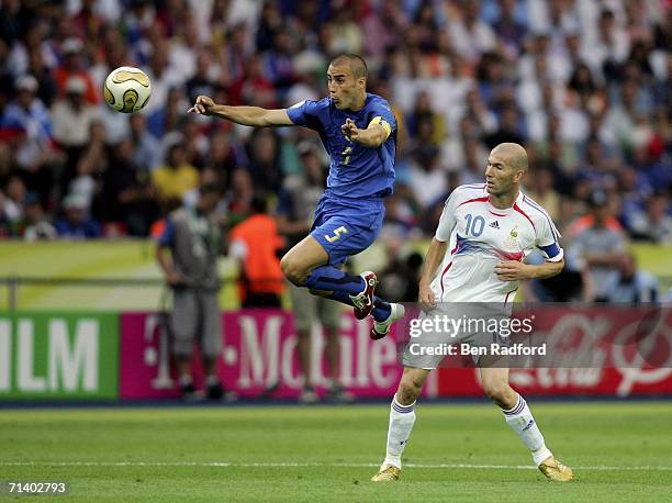 Fabio Cannavaro of Italy controls the ball under pressure from Zinedine Zidane of France during the FIFA World Cup Germany 2006 Final match between...