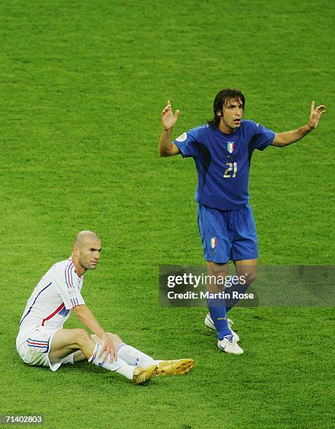 Zinedine Zidane of France holds his leg as Andrea Pirlo of Italy gestures during the FIFA World Cup Germany 2006 Final match between Italy and France...