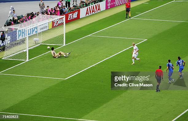 Zinedine Zidane of France scores the opening goal from the penalty spot past Goalkeeper Gianluigi Buffon of Italy during the FIFA World Cup Germany...