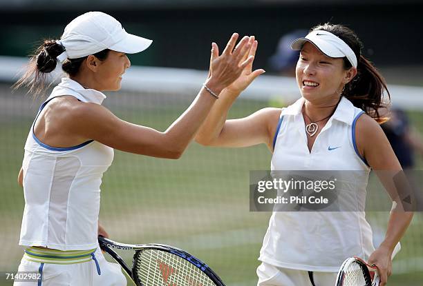 Women's doubles players, Zi Yan and Jie Zheng of China celebrate a point in their final match against Virginia Ruano Pascual of Spain and Paola...