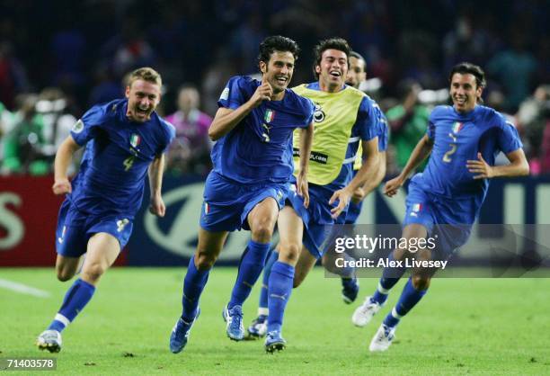 Fabio Grosso of Italy celebrates victory with his team mates, after scoring the winning penalty in a penalty shootout at the end of the FIFA World...