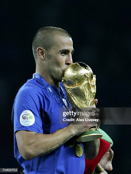 Fabio Cannavaro the captain of Italy kisses the world cup trophy after his team's victory during the FIFA World Cup Germany 2006 Final match between...
