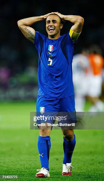 Fabio Cannavaro of Italy celebrates his team's victory in a penalty shootout at the end of the FIFA World Cup Germany 2006 Final match between Italy...