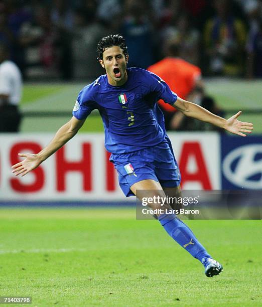 Fabio Grosso of Italy celebrates scoring the winning penalty in a penalty shootout at the end of the FIFA World Cup Germany 2006 Final match between...