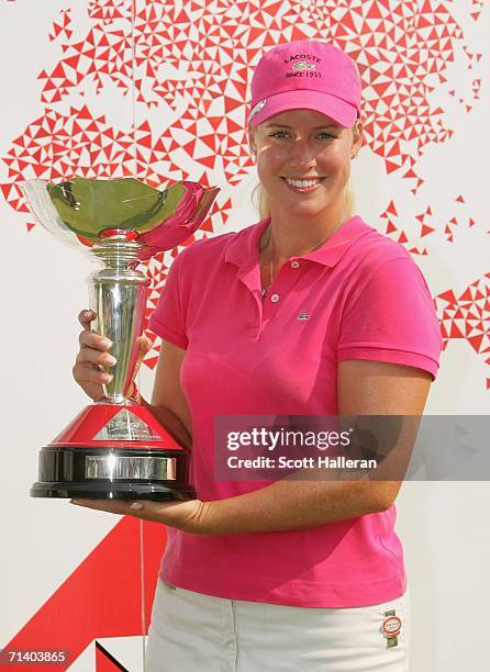 Brittany Lincicome poses with the championship trophy after winning her final against Juli Inkster 3 and 2 in the finals of the HSBC Women's World...