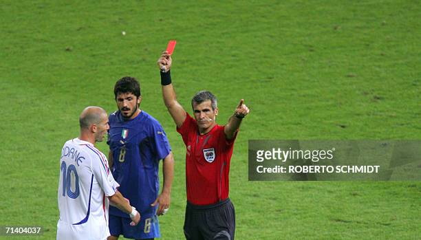 French midfielder Zinedine Zidane receives a red card from referee Horacio Elizondo of Argentina for apparently head-butting Italian defender Marco...