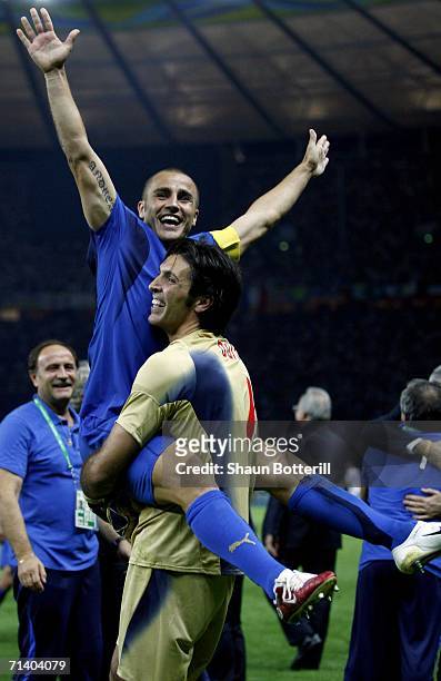 Fabio Cannavaro the captain of Italy, is carried aloft by teammate, Gianluigi Buffon after the FIFA World Cup Germany 2006 Final match between Italy...