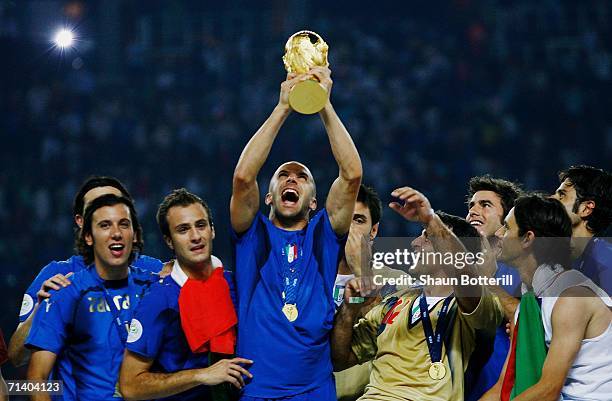 Alessandro Del Piero of Italy holds the World Cup trophy aloft following his team's victory in a penalty shootout at the end of the FIFA World Cup...