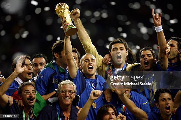 Fabio Cannavaro the captain of Italy, celebrates with his team and coach following their victory during the FIFA World Cup Germany 2006 Final match...