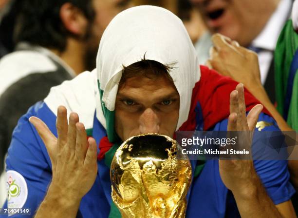 Francesco Totti of Italy celebrates with the world cup trophy following his team's victory during the FIFA World Cup Germany 2006 Final match between...