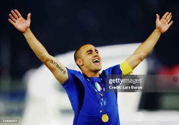 Fabio Cannavaro of Italy celebrates his team's victory in a penalty shootout at the end of the FIFA World Cup Germany 2006 Final match between Italy...