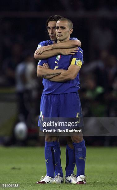 Fabio Cannavaro of Italy is hugged by teammate, Andrea Pirlo, as they watch the penalty shoot out during the FIFA World Cup Germany 2006 Final match...