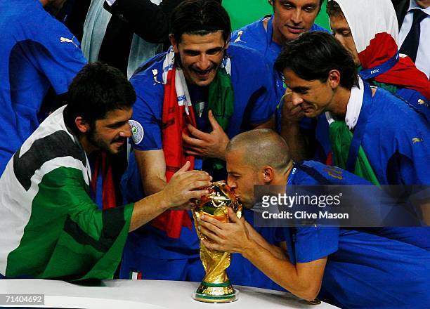 Alessandro Del Piero of Italy kisses the World Cup trophy following his team's victory in a penalty shootout at the end of the FIFA World Cup Germany...