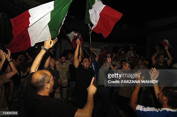 Italian NATO soldiers react as Italy won the FIFA World Cup 2006 final on TV in Kabul, 09 July 2006. Italy won the World Cup final on penalties after...
