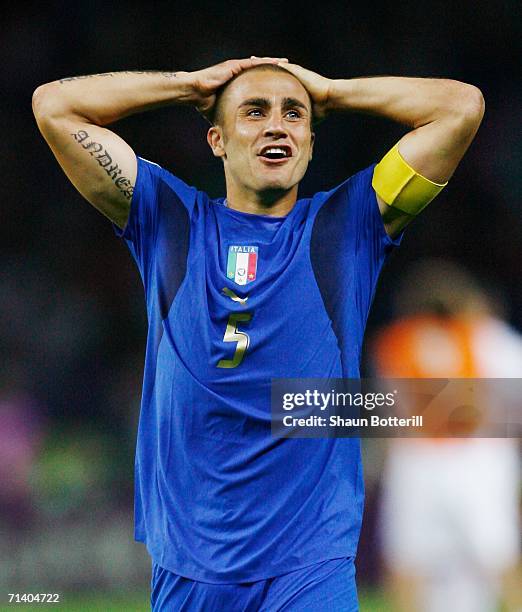 Fabio Cannavaro of Italy reacts following his team's victory in a penalty shootout at the end of the FIFA World Cup Germany 2006 Final match between...