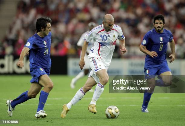 Zinedine Zidane of France goes past Andrea Pirlo and Gennaro Gattuso of Italy during the FIFA World Cup Germany 2006 Final match between Italy and...