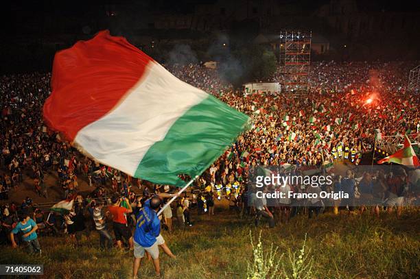 Italian football fans at the Circo Massimo celebrating Italy's victory over France on July 09, 2006 in Rome, Italy. Italy defeated France 5-3 at the...