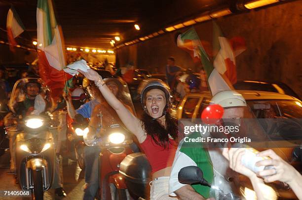 Italian football fans celebrate Italy's victory over France on July 09, 2006 in Rome, Italy. Italy defeated France 5-3 at the World Cup 2006 finals...