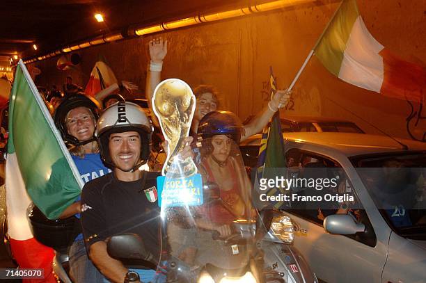 Italian football fans celebrate Italy's victory over France on July 09, 2006 in Rome, Italy. Italy defeated France 5-3 at the World Cup 2006 finals...