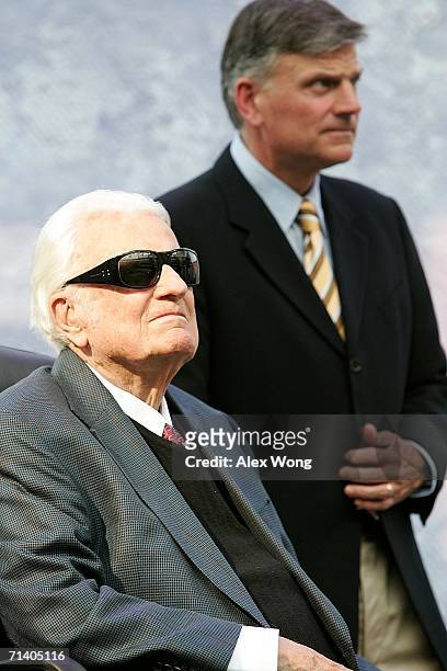 Evangelist Billy Graham and his son Franklin take part in the Metro Maryland 2006 Festival July 9, 2006 at Oriole Park at Camden Yards in Baltimore,...