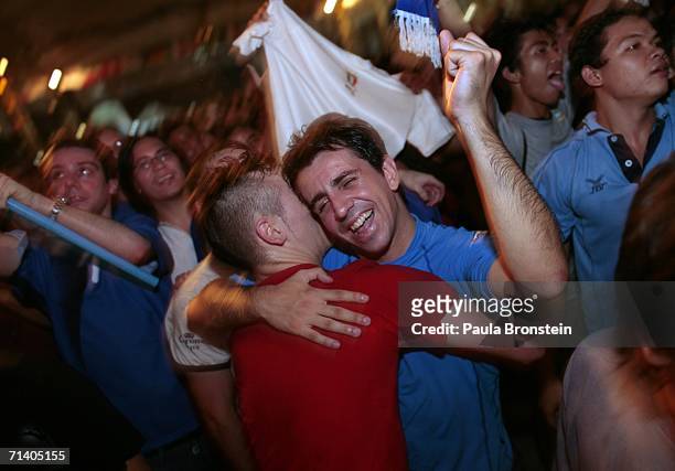 Italian tourists Antonio and Marco celebrate after Italy won the penalty shoot out to win the World Cup July 10, 2006 in Bangkok, Hundreds turned out...