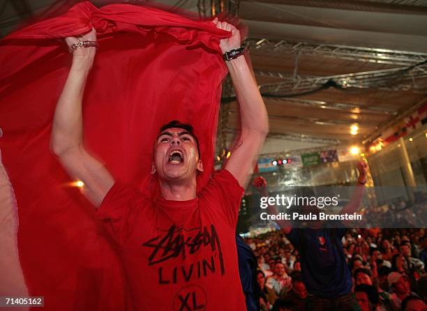 Italian tourist Antonio celebrates after Italy won the penalty shoot out to win the World Cup July 10, 2006 in Bangkok, Hundreds turned out in...