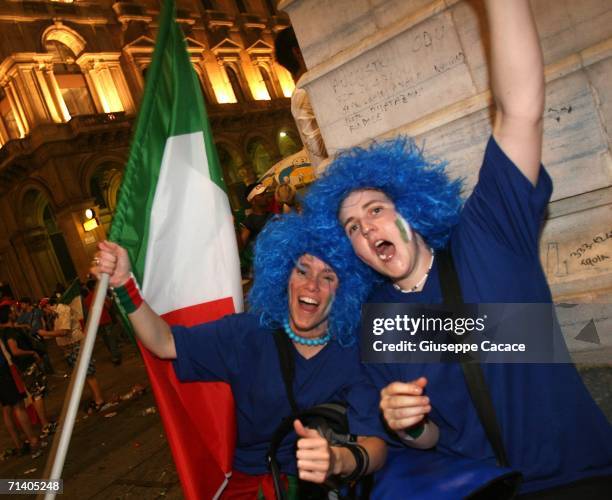 Italian football fans celebrate Italy's victory at the World Cup 2006 finals on July 9, 2006 in Milan, Italy. Italy defeated France at the World Cup...