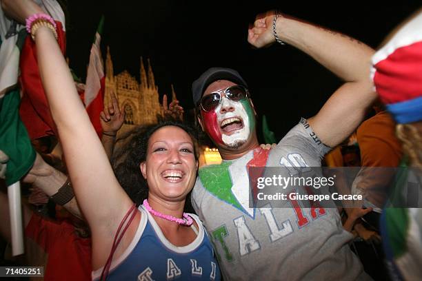 Italian football fans celebrate Italy's victory at the World Cup 2006 finals on July 9, 2006 in Milan, Italy. Italy defeated France at the World Cup...