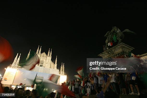 Italian football fans celebrate Italy's victory at the World Cup 2006 finals in "Piazza del Duomo" on July 9, 2006 in Milan, Italy. Italy defeated...