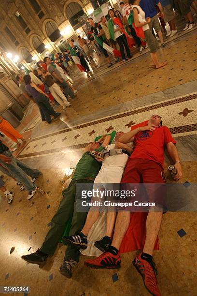 Italian football fans celebrate Italy's victory at the World Cup 2006 finals in "Galleria Vittorio Emanuele " on July 9, 2006 in Milan, Italy. Italy...