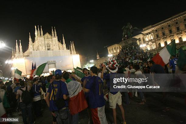 Italian football fans celebrate Italy's victory at the World Cup 2006 finals in "Piazza del Duomo" on July 9, 2006 in Milan, Italy. Italy defeated...